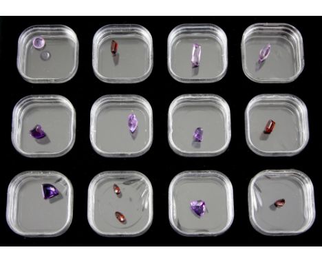 Gem box containing eight faceted amethysts and five garnets, including marquise cut amethyst, measuring approximately 13.71 x