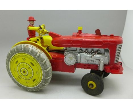 A tin plate and plastic model tractor, made in Gt. Britain