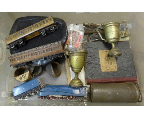 Assorted railway items, a LNER signalman's handwritten instruction book, two 1950's trophies, four ticket punches, whistles, 