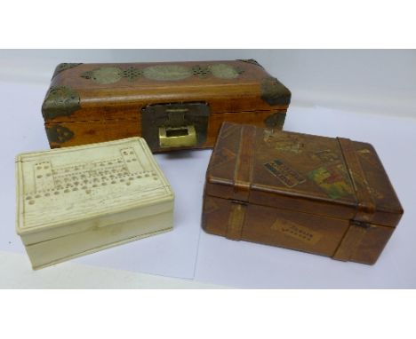 A musical jewellery box in the form of a small travel trunk, a jewellery box and a carved ivory box, a/f