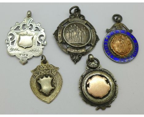 A silver Sunday School 1922 cricket fob, a silver and enamel fob with gold decoration G.C.&C.C. Cricket Competition fob medal