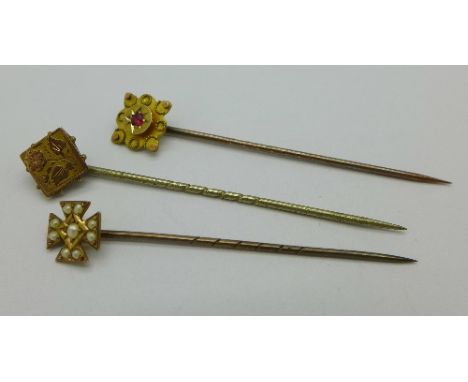 Three 9ct gold stick pins