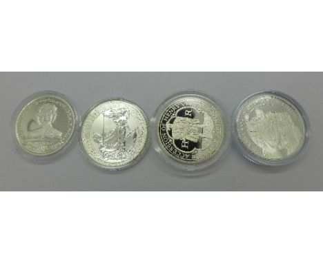 A one ounce fine silver £2 coin, a £2 commemorative coin and two £5 commemorative coins