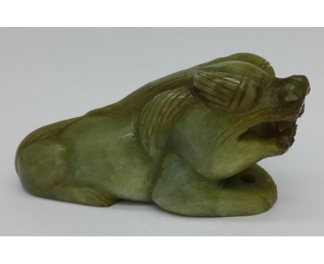 A carved jade figure of a dog, length 10.5cm
