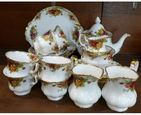 Royal Albert Old Country Roses teaware comprising teapot, two cake plates, one side and medium plate, nine small plates, eigh