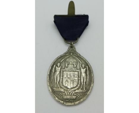 A white metal medallion, tests as silver, 37g