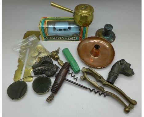 A corkscrew, buttons, a brass button cleaning cover, nutcrackers, a Moskvitch model vehicle, etc.