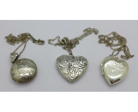 Three silver lockets and chains