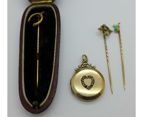 A 9ct gold wishbone stick pin, a gold and turquoise stick pin, one other stick pin and a 9ct gold back and front locket