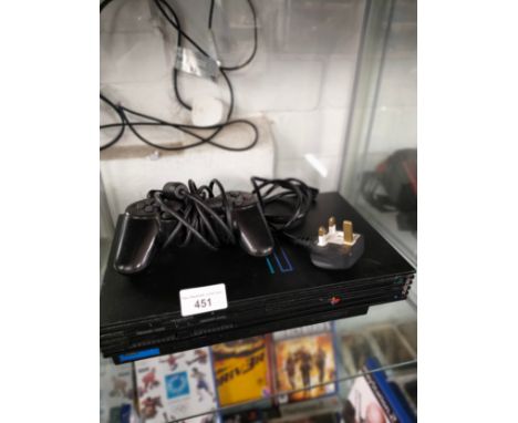 Playstation 2 console with controller and power pack . 