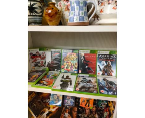 Shelf of Xbox 360 games . 