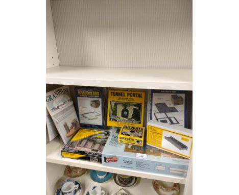 Shelf of railways building kits etc . 