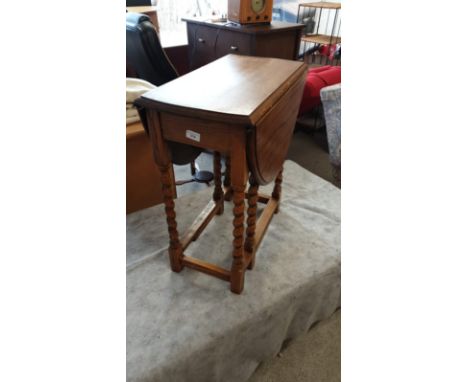 Antique light oak barley twist drop leaf table . 