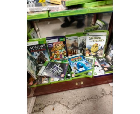 Shelf of Xbox 360 games . 