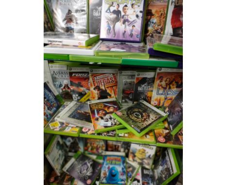 Shelf of Xbox 360 games . 