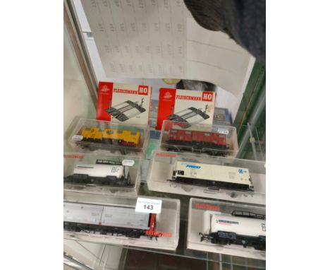 Shelf of fleishmann train vehicles boxed . 