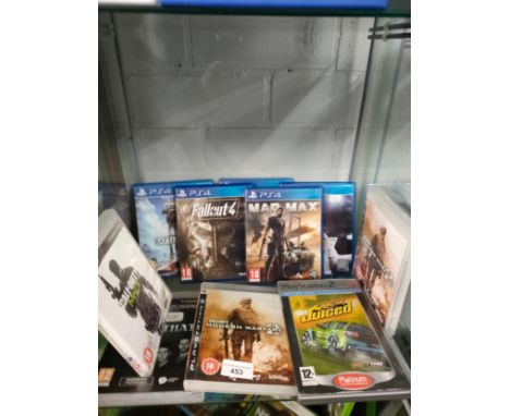 Shelf of playstation 3 and 4 games . 