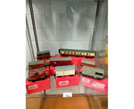 Shelf of Hornby Duplo wagons etc .