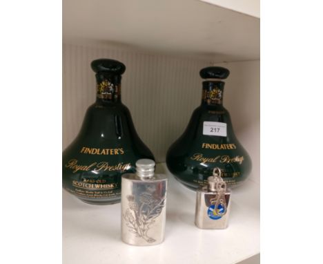 2 scotch whisky decanters together with 2 mini flasks . 