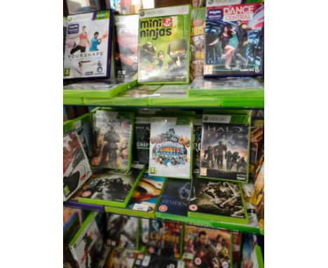 Shelf of Xbox 360 games . 