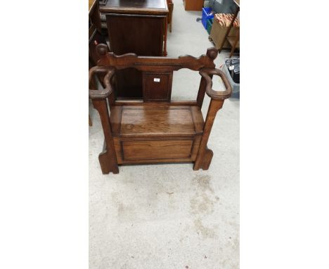 Antique hall armchair with fitted stick stand . 