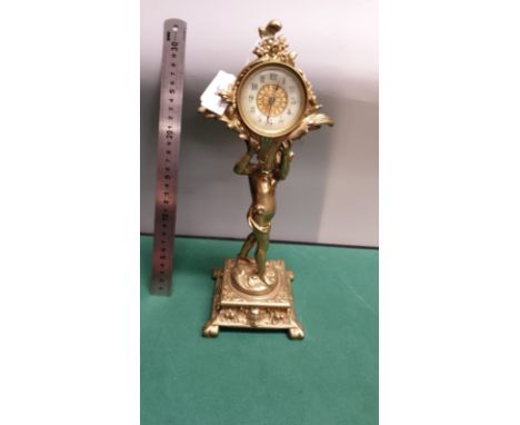 Beautiful Brass Victorian Clock With Putti Cherub Holding Clock Upright With Elaborate Art Work To Base Ticking Winding 