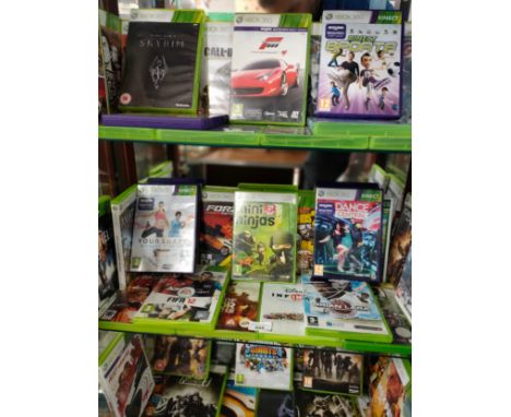 Shelf of Xbox 360 games . 