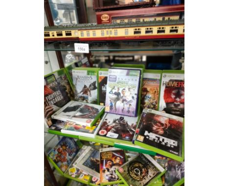 Shelf of Xbox 360 games . 