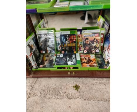 Shelf of Xbox 360 games . 