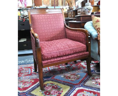 A 19th century Biedermeier style mahogany framed salon armchair with upholstered panels and cushion seat