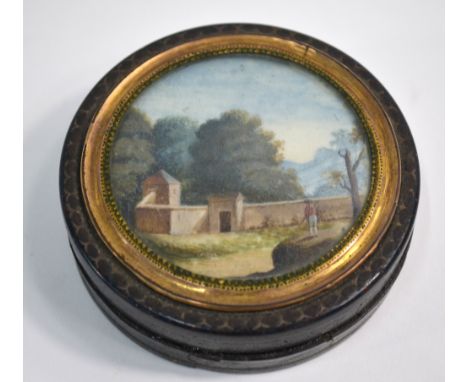 A 19th century Continental circular snuff-box, the cover set with a miniature landscape in gilt surround, tortoiseshell linin