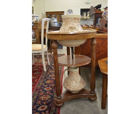 A continental walnut 3-tier washstand c/w a Victorian floral-printed pottery wash ewer, basin and slop-pail