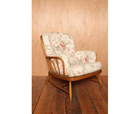 Mid Century beech Ercol wide armchair coming with pale floral upholstered cushions