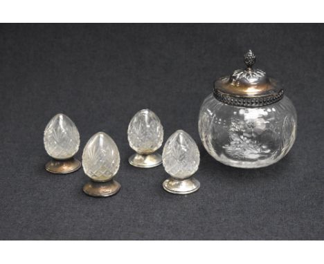 A set of four silver mounted and cut glass salts and pepperettes, of egg motifs having silver filled circular step moulded fe