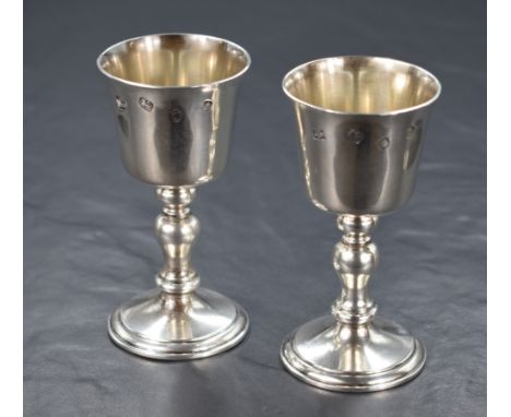 A pair of Elizabeth II silver goblets, of traditional form having knopped stems raised on circular step moulded feet, marks f
