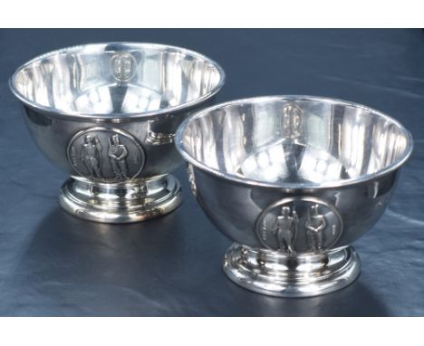 A pair of George V silver footed bowls, having slightly flared step moulded rims, with embossed National Rifle Association lo