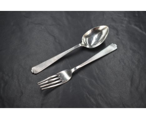 A George VI cased silver christening set, comprising a spoon and fork, having decorative line work to the terminals, marks fo
