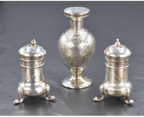 A pair of early 20th century silver pepperettes, of bulbous form raised on three cabriole style legs, along with a Victorian 