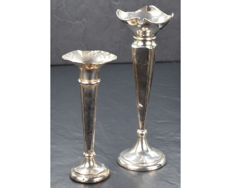 A George V silver vase, of fluted form having a decorative quatrefoil rim with square canted body, raised on a circular step 