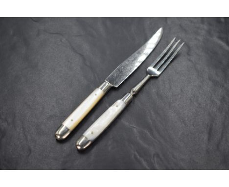 An early 20th century cased set of white metal and mother-of-pearl dessert knives and forks, the blades marked Korner Rein-Ni