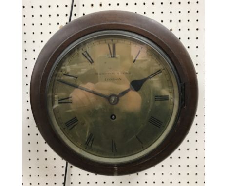 A Victorian mahogany cased circular wall clock with single fusee movement, the circular brass dial with Roman numerals to the