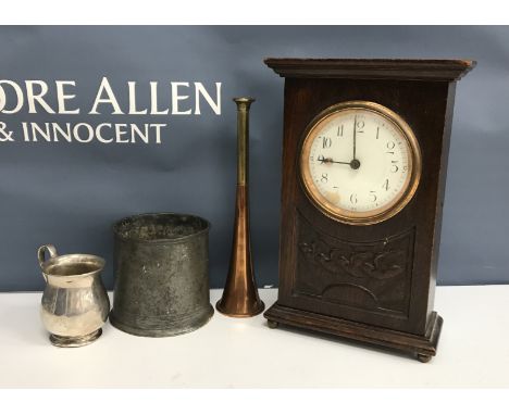 A wooden wine crate containing an early 20th Century oak cased mantel clock with dove and sunburst decoration, the white enam