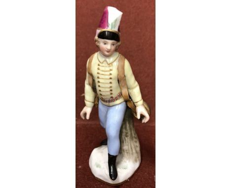 A Meissen figure of a "Soldier stood beside a tree trunk", bears blue crossed swords mark to base and incised No. "2163", 11 