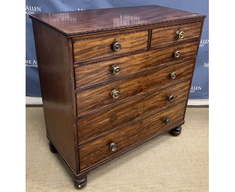 A 19th Century mahogany chest of two short over four long graduated drawers with pressed brass handles raised on turned feet,