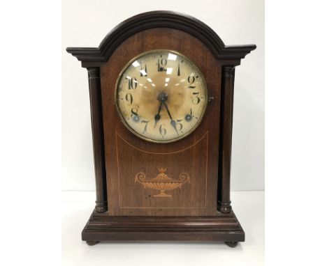 A circa 1900 American mahogany cased mantel clock with eight day movement, the circular paper dial with Arabic numerals, 37 c