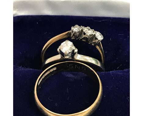 An 18 carat gold mounted three stone diamond ring, size M, 3 g, an 18 carat white gold mounted solitaire diamond ring, approx