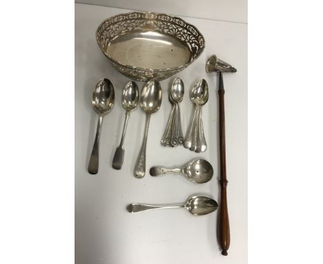 A collection of silver wares to include an oval bonbon dish with pierced decoration, raised on an oval foot (by S Blanckensee