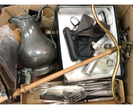 A box of various cutlery, pewter water jug, brass and turned wood coat hanger, various leather jewellery boxes, a pair of bra