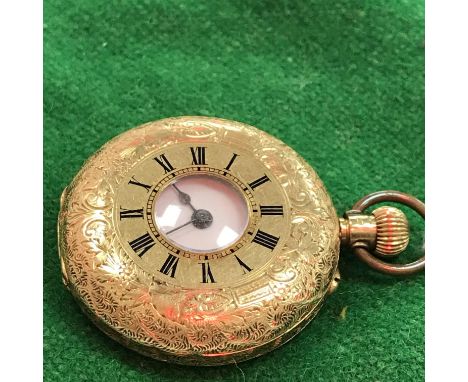 An 18 carat gold foliate engraved cased lady's pocket or fob watch, half hunter with black Roman numerals to the chapter ring