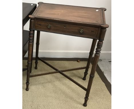 A late Regency mahogany and rosewood strung side table, the plain top with slightly raised beading over a single frieze drawe